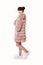 Fashion studio teen look style in pink fur coat and trendy shoes