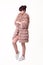 Fashion studio teen look style in pink fur coat and trendy shoes