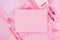 Fashion stylish workplace - blank paper for text on neon pink office stationery collection on pastel background, top view.