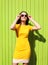 Fashion summer sunny portrait of beautiful young woman in yellow