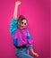 Fashion Teenager Girl in vintage sunglasses dances disco 80s 90s.