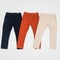 Fashion - three pants of different color for children, photo on neutral background