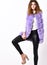 Fashion trend concept. Winter fashionable wardrobe for female. Boutique selling fur. Violet fur vest fashion clothing