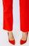 Fashion unrecognizable Lady legs in red pants and shoes.  Minimalist elegant details style