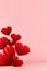 Fashion Valentine day stage in chinese style red paper hearts of fans soar as flow on pink color, copy space, vertical. Love.