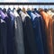 Fashion variety Colorful mens suits hanging in a store display