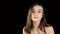 Fashion video of beauty woman on dark background. Woman hand straightens her hair, and poses for the camera