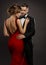 Fashion Wedding Couple in Love. Beauty Woman in Sexy Dress with Naked Back and Handsome Man in Black Suit. Gentlemen and Lady