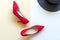 Fashion woman accessories set. Trendy fashion red shoes heels, back big hat.