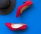 Fashion woman accessories set. Trendy fashion red shoes heels, stylish big hat. blue background.