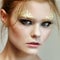 Fashion woman - beauty gilded golden make-up