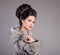 Fashion Woman in mink fur coat. Beauty makeup. Elegant hairstyle