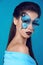 Fashion woman Portrait. Butterfly makeup, face art make up