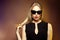 Fashion woman in sunglasses, studio shot. Professional makeup an