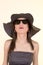 Fashion woman wearing sunglasses and hat.