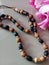 A fashionable accessory with elegant bead necklaces and bracelets.