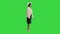 Fashionable african american woman posing in knitwear and white hat on a Green Screen, Chroma Key.