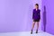 fashionable beautiful mulatto model posing in purple jacket on ultra