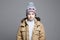 Fashionable Boy in winter outerwear. knitted hat