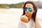 Fashionable brunette woman portrait in sunglasses - closeup