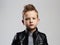 Fashionable child in leather coat.stylish child with trendy haircut