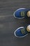 fashionable children shoes on wooden floor, view from top, selfie