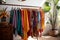 Fashionable and colorful clothes on trendy rack in stylish and organized closet display