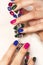 Fashionable colorful short nail art design on female hand