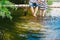 Fashionable cool couple on a bridge near the water, relationships, romance, legs, lifestyle - concept