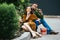 fashionable couple in velvet clothing eating fried chicken legs