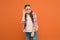 Fashionable cutie. Being smart. Little smart schoolgirl on orange background. Child smart look through eyeglasses. Small