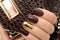 Fashionable gold and brown nail design