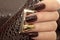 Fashionable gold and brown nail design