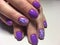 fashionable lilac manicure with a white design