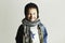 Fashionable little boy in scarf and jeans.winter style.fashion kids.funny child.smiling happy