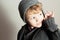 Fashionable Little Boy.Stylish Handsome Kid. Fashion Children. in suit, sweater and cap
