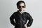 Fashionable little boy in sunglasses. Child in Black cap. Winter style.Kids fashion