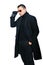 Fashionable man in black coat isolated oover white background