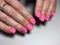 fashionable matte pink manicure with abstraction