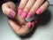 fashionable matte pink manicure with abstraction