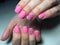 fashionable matte pink manicure with abstraction