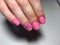 fashionable matte pink manicure with abstraction