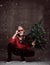 Fashionable modern Santa old man in red fashion hoodie under snow Merry Christmas