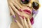 Fashionable multi-colored makeup and manicure on long nails