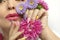 Fashionable multi-colored makeup and manicure on long nails