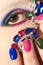 Fashionable multi-colored manicure short nails and makeup