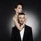 Fashionable photo of beautiful naked lady and man in suit