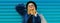 Fashionable portrait stylish blonde woman with two shopping bags wearing a blue faux fur coat, black round hat on colorful