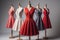 fashionable red and white dresses on mannequins in studio. generative ai