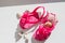 Fashionable sandals, seashells on white background, top view, flat lay.summer pink Shoes for kids, Children`s slippers